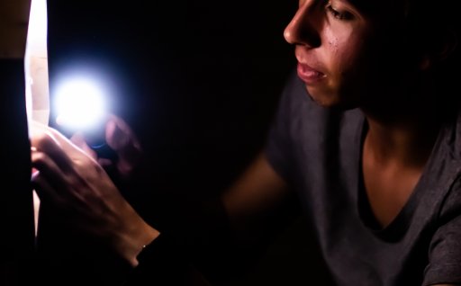 Player examines something with a flashlight
